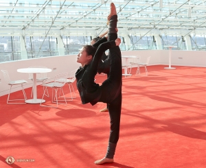 Principal Dancer Xindi Cai takes advantage of the open spaces of the lobby at the Kauffman Center.