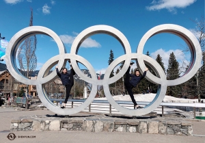 The 2010 Winter Olympics were held right here in Whistler! Dancers Hannah Jao (left) and Sophia Chang use the Olympic rings to aid their stretching. (Photo by Eva Su)