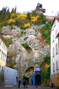An incredible winding staircase ascends to the top of a cliff. It's a long way up, but the dancers are curious to have a look. Let&rsquo;s go! (Photo by dancer Tony Zhao)
