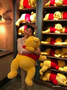 Melody Qin finds a new friend at Pooh Corner.